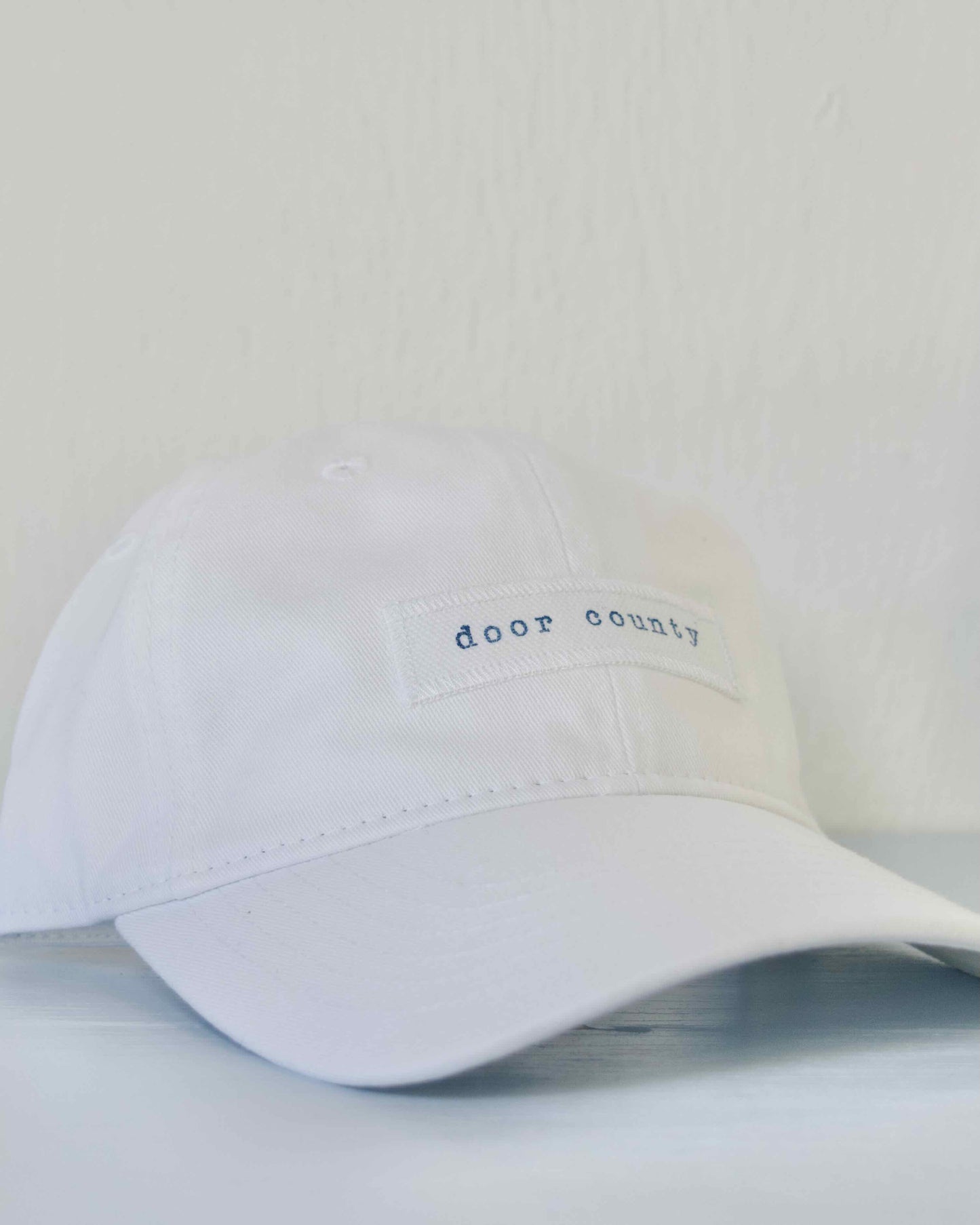 Door County Hand Stamped White Baseball Cap